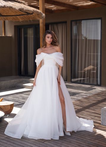 Buy Caprice Natalia Romanova's wedding dress from the 2024 collection at the Mary Trufel boutique